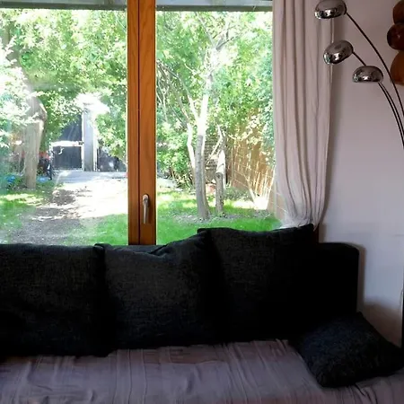 Holiday home Maison En Bois Au Fond Du Jardin