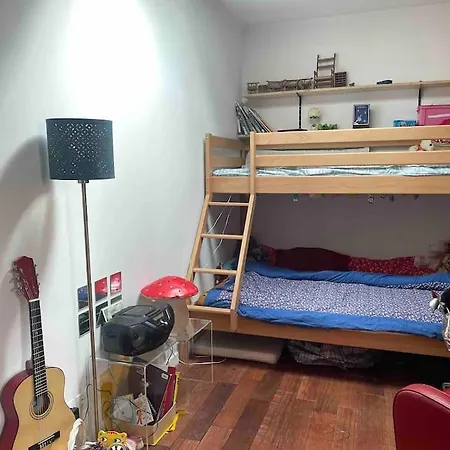 Maison En Bois Au Fond Du Jardin Holiday home *